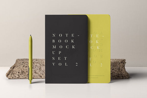 Mockup of 2 Standing Notebooks with Stone and Pen