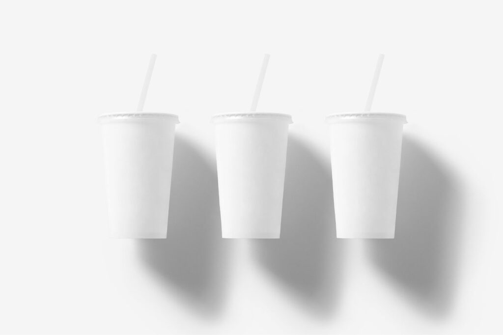 Mockup of 3 Floating Coffee Cups with Straws in the Front View