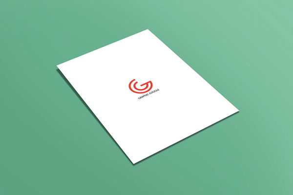 Mockup of a Flat A4 Flyer Laid on the Surface in Perspective