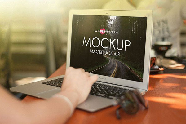 Mockup of a MacBook Air in Front of a Woman