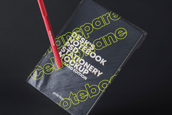 Mockup of a Notebook with Transparent Cover and a Pen