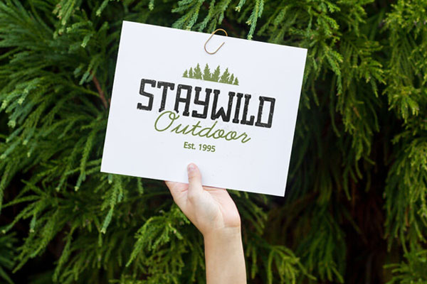 Mockup of a Person’s Hand Holding Up a Card in the Air