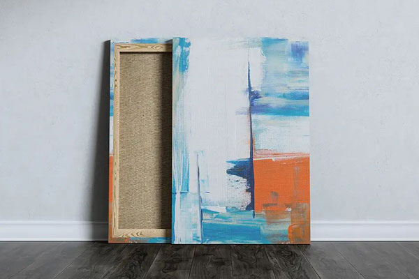 Mockup of a Portrait Canvas Leaning Against the Wall
