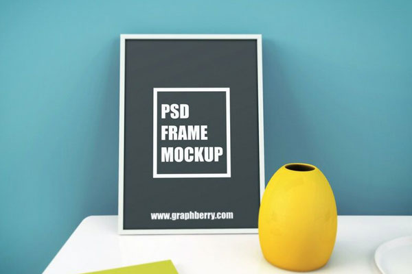 Mockup of a Standing Photo Frame on a Table