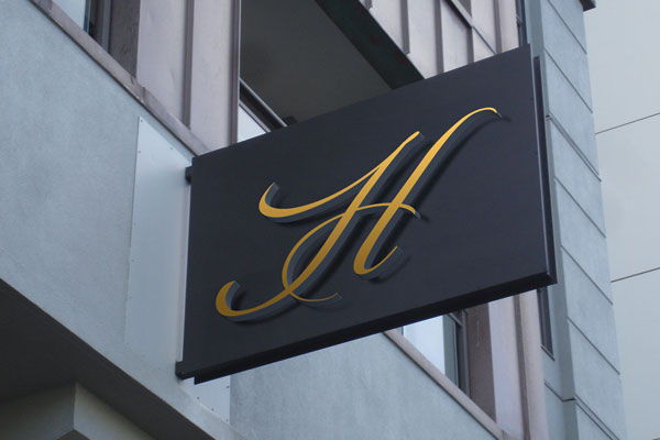 Mockup of a Wall Mounted Hotel Entrance Signage