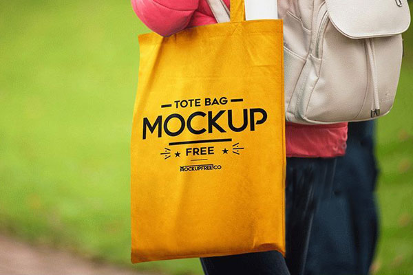 Mockup of a Woman Carrying a Tote Bag