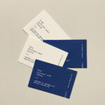 Mockup of Business Cards Lying on Paper
