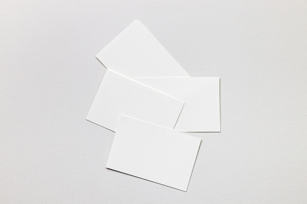 Mockup of Business Cards Lying on Paper