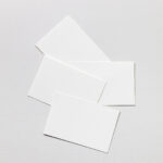 Mockup of Business Cards Lying on Paper