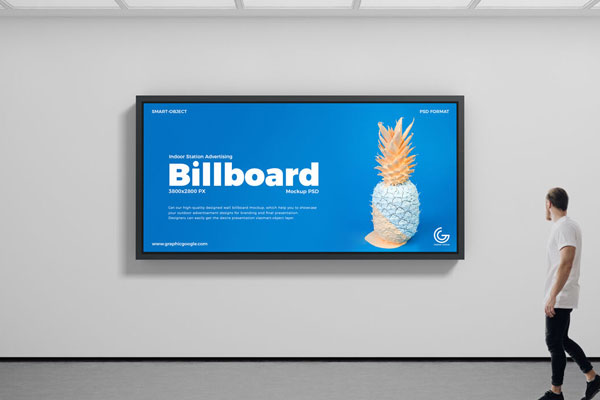 Mockup of Indoor Horizontal Billboard Featuring a Man Passing by