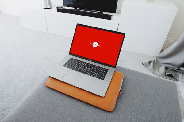 Mockup of MacBook Pro in Living Room with a Wide 3\4 Angle View