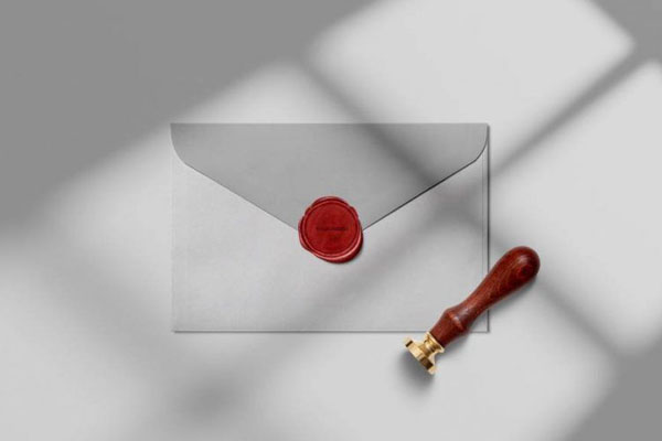 Mockup of the Wax Seal Stamp Along with an Envelope in Top View