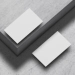 Mockup of Two Floating Business Cards at the 34 Angle View