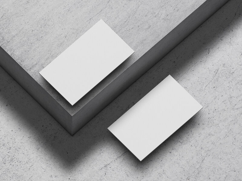 Mockup of Two Floating Business Cards at the 34 Angle View