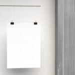 Mockup Showcasing a Vertical Poster Hanging with Paper Clips