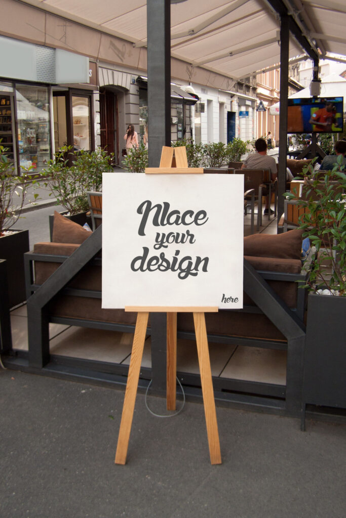 Mockup Showcasing Easel Holding a Square Canvas on Outdoor Environment