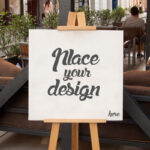 Mockup Showcasing Easel Holding a Square Canvas on Outdoor Environment