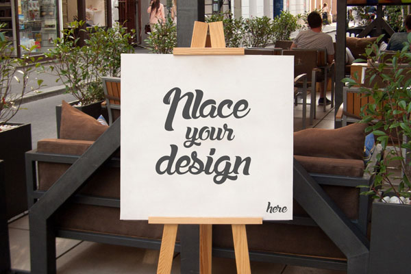 Mockup Showcasing Easel Holding a Square Canvas on Outdoor Environment