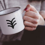 Mockup Showcasing Girl Holding Metal Mug