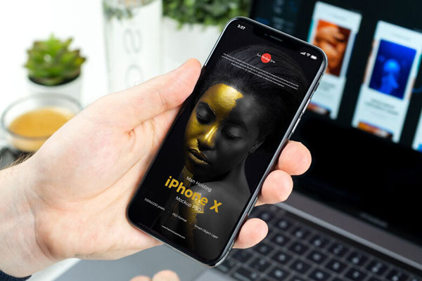Mockup Showcasing Man Holding iPhone X