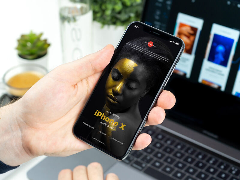 Mockup Showcasing Man Holding iPhone X