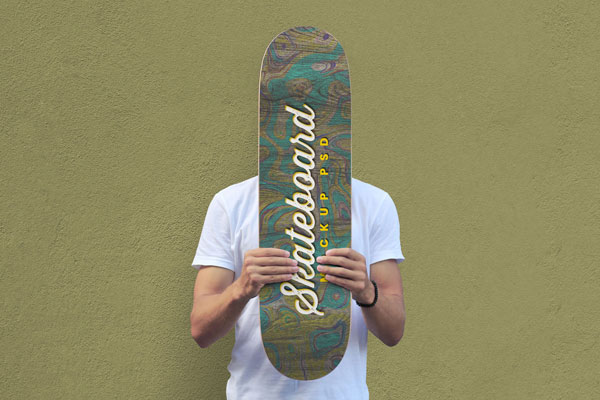 Mockup Showcasing Man Holding Skateboard in Front of His Face