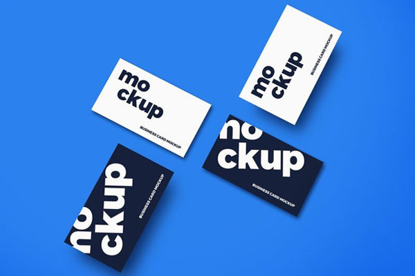 Mockup Showcasing Overhead View of Four Scattered Business Cards