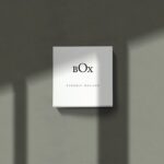 Mockup Showcasing Square Box in Four Different Scenes with Overlayed Shadows
