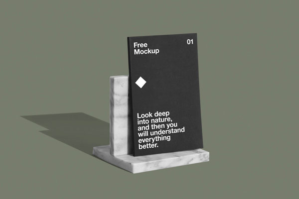 Mockup Showcasing Thin Book on Stone Stand