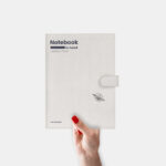 Mockup Showcasing Woman’s Hand Holding Leather Notebook