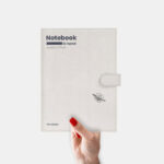 Mockup Showcasing Woman’s Hand Holding Leather Notebook