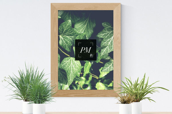 Mockup Showcasing Wooden Frame Poster and Vases
