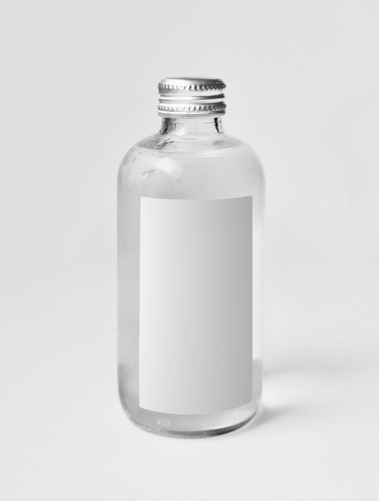 Mockup Showing a Minimal Mini Glass Bottle