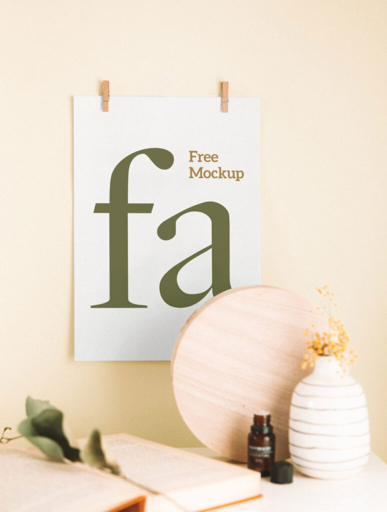 Mockup Showing a Poster Hanging on the Wall with Two Clips