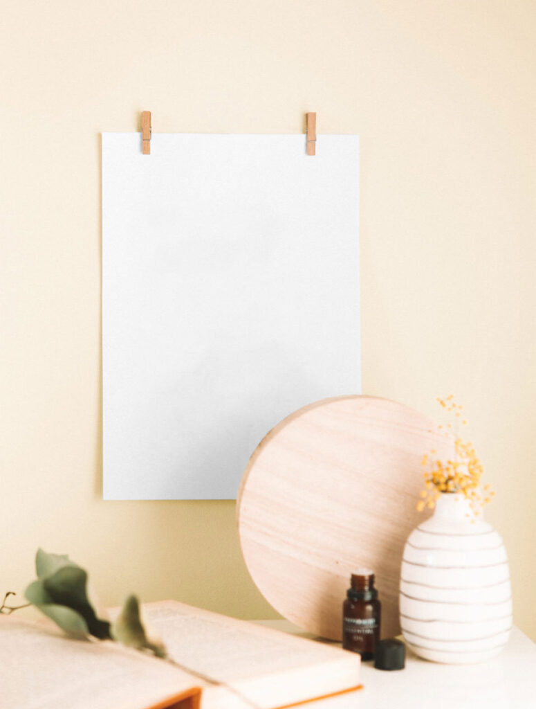 Mockup Showing a Poster Hanging on the Wall with Two Clips