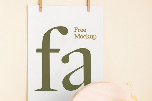 Mockup Showing a Poster Hanging on the Wall with Two Clips