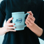 Mockup Showing a Woman Holding a Mug