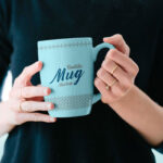 Mockup Showing a Woman Holding a Mug