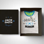 Mockup Showing an Opened Box Containing Folded T-Shirt