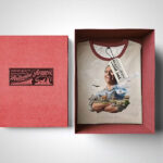Mockup Showing an Opened Box Containing Folded T-Shirt