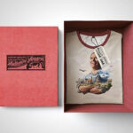 Mockup Showing an Opened Box Containing Folded T-Shirt