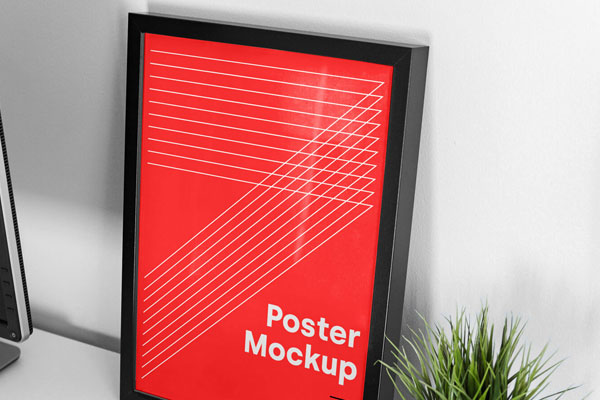 Mockup Showing Frame Poster on a Table with Laptop and Vase