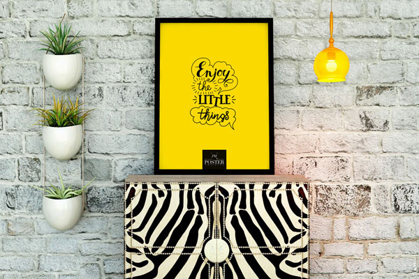 Mockup Showing Poster on Zebra Table in a Setting Decorated with Vases, Lamp and Brick Wall