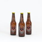 Mockup Showing Three Standing Beer Bottles with Metallic Caps
