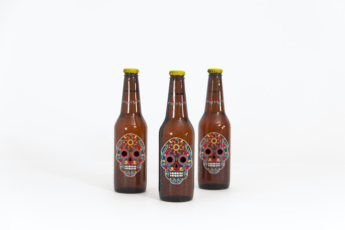 Mockup Showing Three Standing Beer Bottles with Metallic Caps FREE PSD