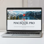 Open MacBook Pro on a Table Mockup