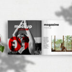 Opened Magazine Mockup Between a Cup of Tea and a Wheat Branch