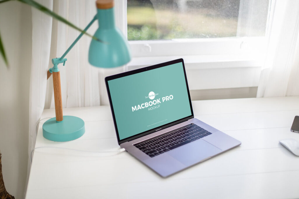 Opened Silver MacBook Pro on a Home Office Desk Mockup