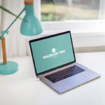 Opened Silver MacBook Pro on a Home Office Desk Mockup