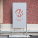 Outdoor Advertising Stand next to a Wall Mockup